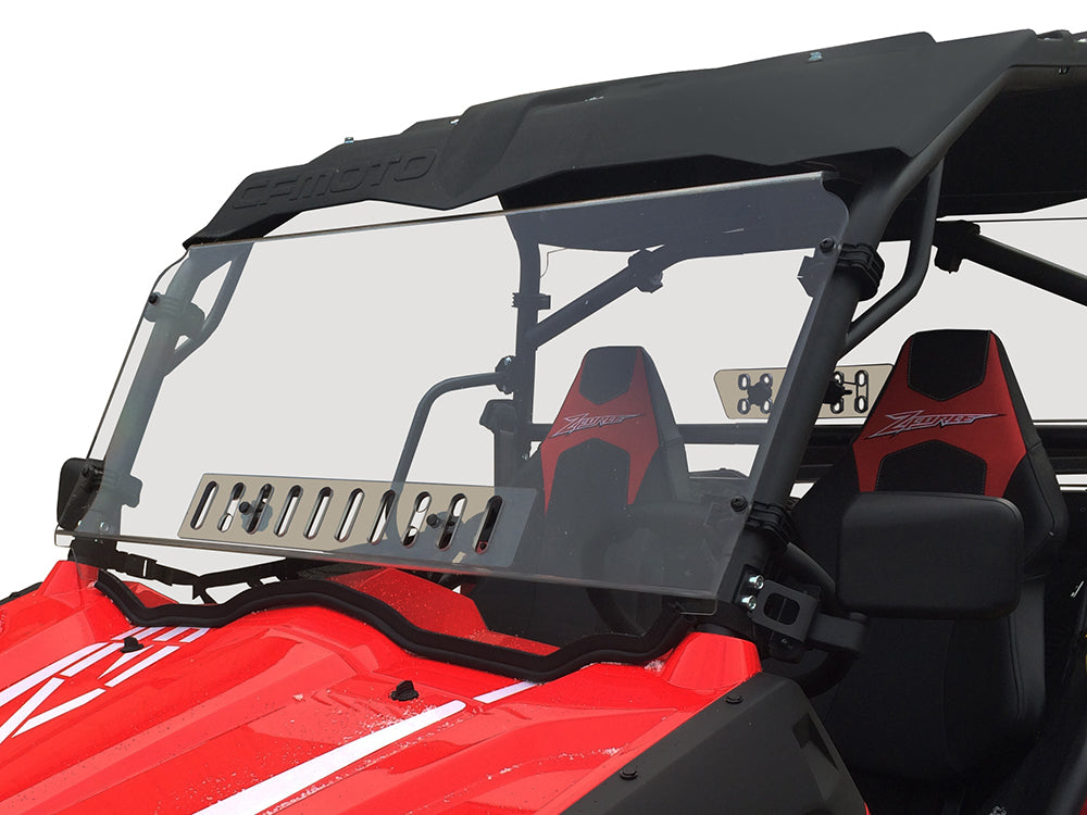 A Cf Moto Z-Force 500/600/800/1000 Full Venting Scratch Resistant Windshield with metal vents is mounted on a red off-road utility vehicle featuring black and red Z-logo bucket seats, a roof, roll bars, and a rugged design, against a plain white backgroun